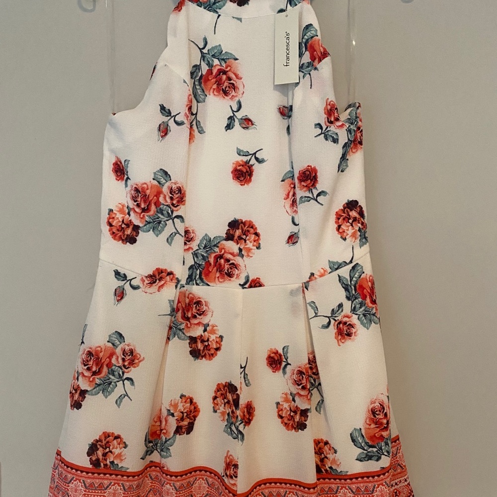 White and floral romper with pockets
